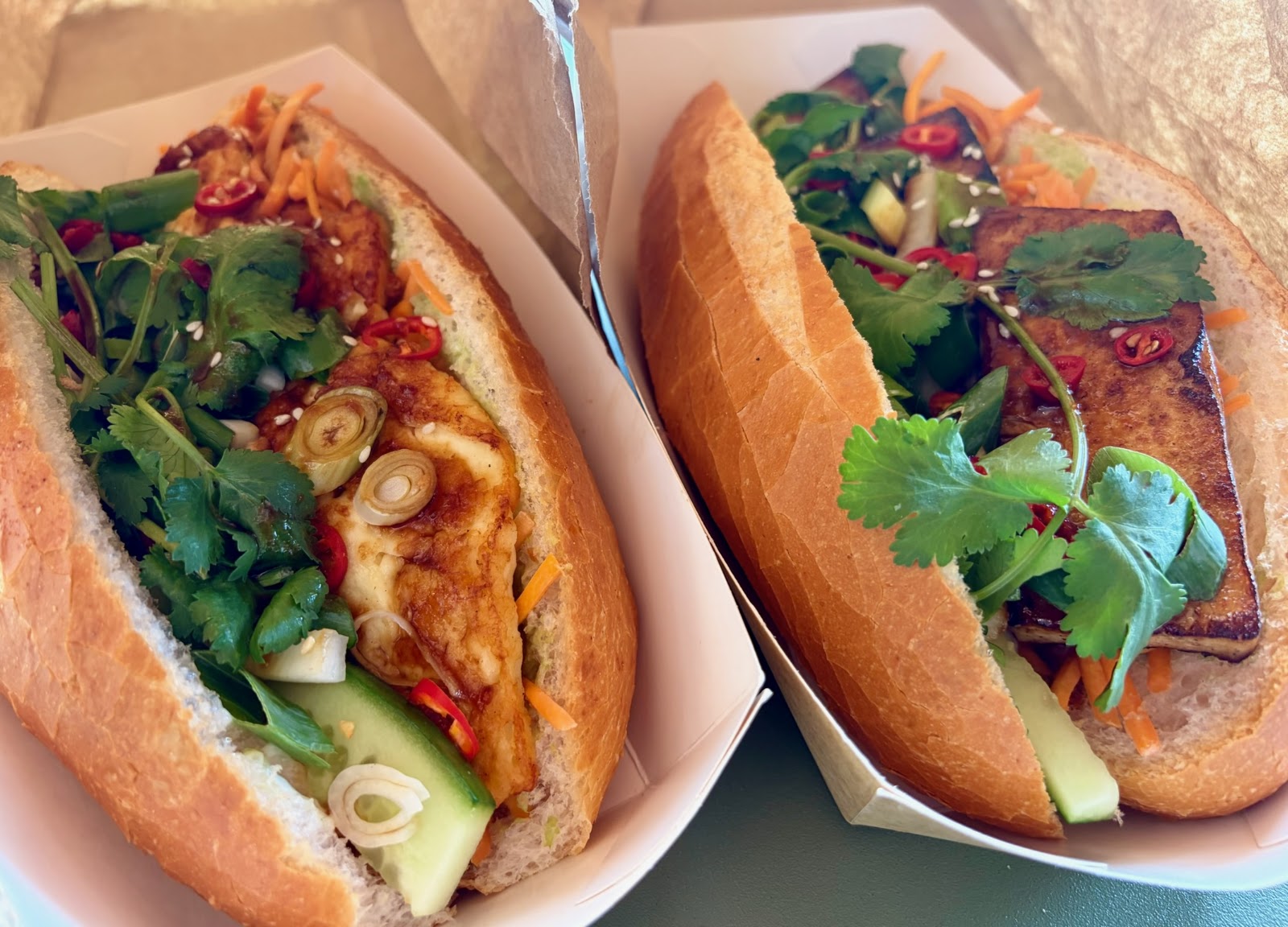 A chicken roll and a marinated tofu roll side by side