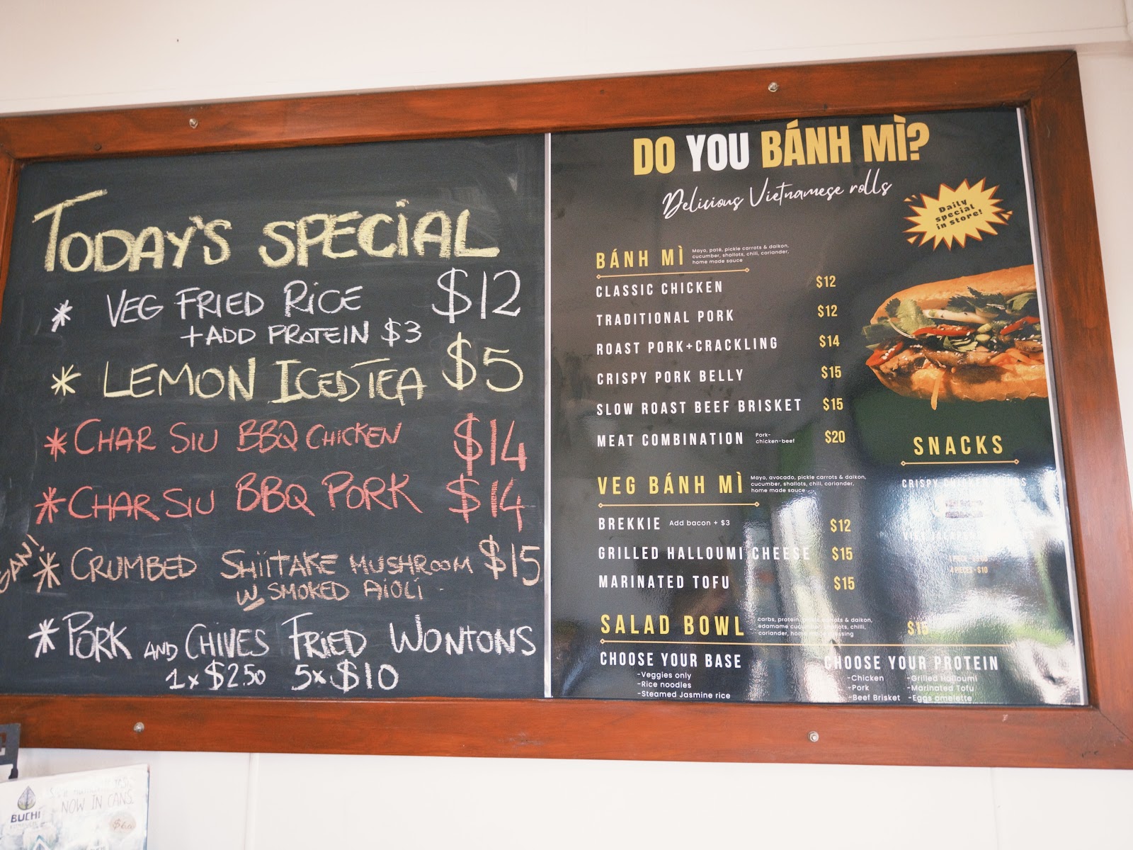 The chalk specials board and printed menu board inside the shop
