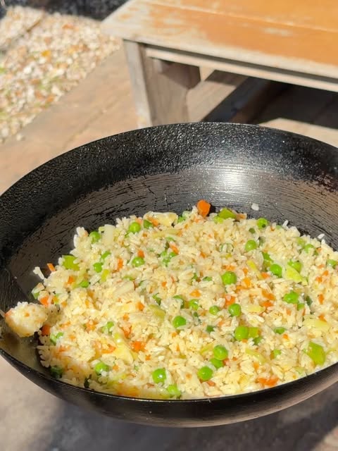 Veg fried rice tossed in a wok